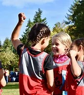 Kids cheering at the end of a race